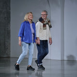 Senior couple walking side by side in comfortable black Diawin sneakers