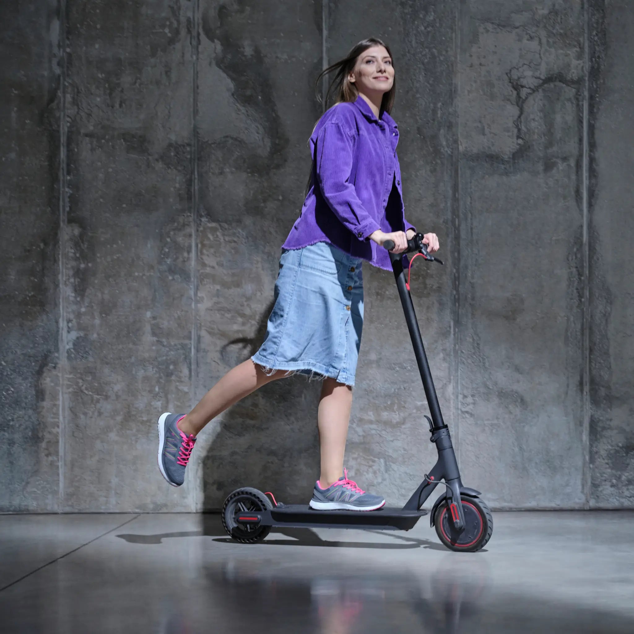 DW sneakers for wide and diabetic feet, worn by person riding a scooter.