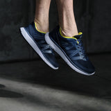 Close-up of Diawin navy shoes for diabetics in mid-air, emphasizing their lightweight and comfortable design.